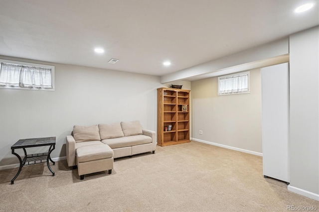 living room with carpet flooring, recessed lighting, baseboards, and visible vents