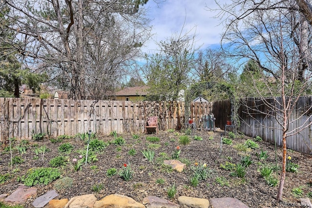view of yard with a fenced backyard