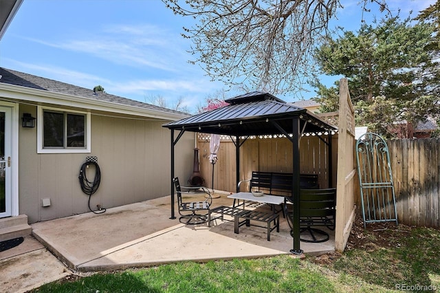 view of patio / terrace with a gazebo and fence