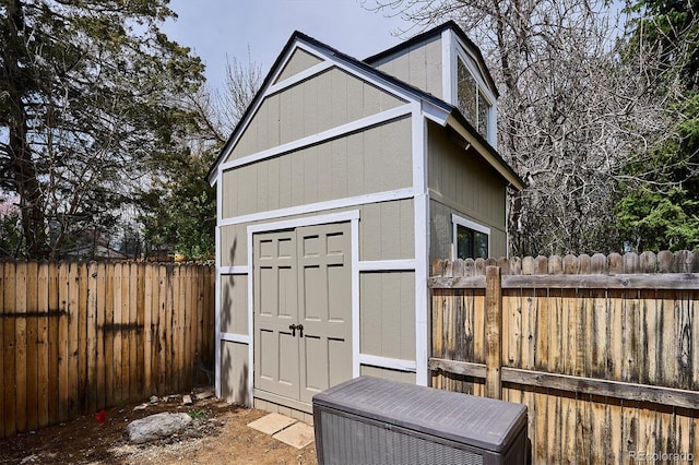 view of shed featuring a fenced backyard