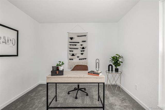 carpeted office space with baseboards