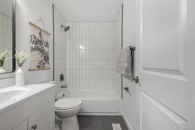 bathroom with tile patterned flooring, toilet, visible vents, bathing tub / shower combination, and vanity