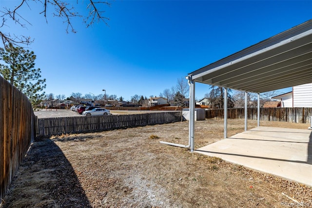 view of yard with a patio area and a fenced backyard