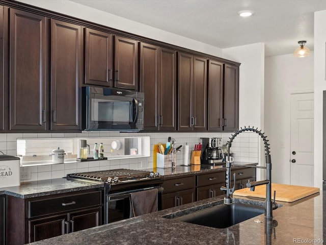 21901 E 42nd Pl, Aurora, CO 80019 - kitchen featuring black appliances, dark stone counters, tasteful backsplash, and a sink