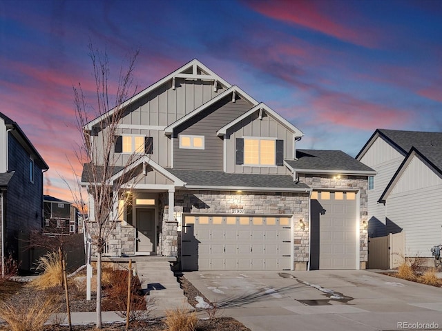 21901 E 42nd Pl, Aurora, CO 80019 - craftsman house with board and batten siding, concrete driveway, and stone siding
