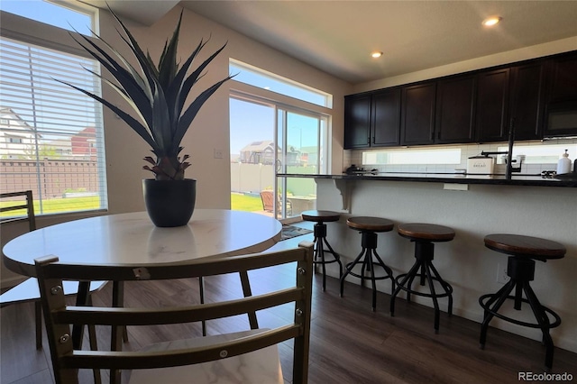 21901 E 42nd Pl, Aurora, CO 80019 - dining room featuring dark wood-type flooring, healthy amount of natural light, and recessed lighting