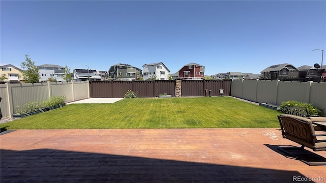 21901 E 42nd Pl, Aurora, CO 80019 - fenced backyard featuring a residential view and a patio area