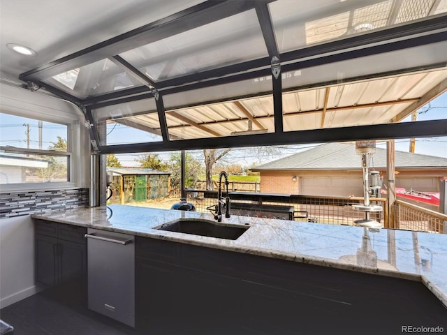view of patio featuring outdoor wet bar, an outdoor kitchen, and a sink