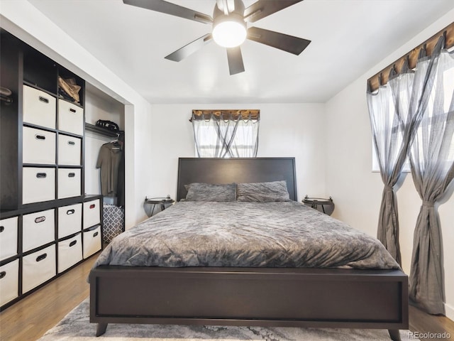 bedroom featuring ceiling fan and wood finished floors