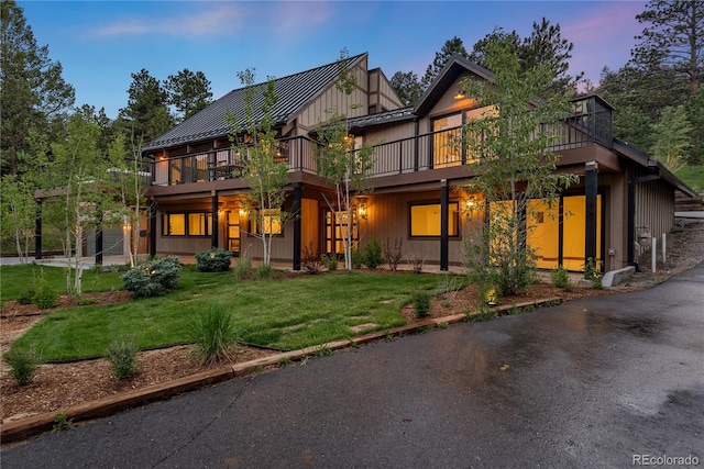 1298 Meadow View Dr, Evergreen, CO 80439 - view of front facade with a front yard, a deck, a standing seam roof, and a metal roof