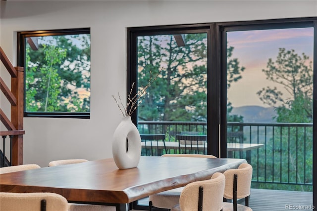1298 Meadow View Dr, Evergreen, CO 80439 - dining space with healthy amount of natural light and stairs