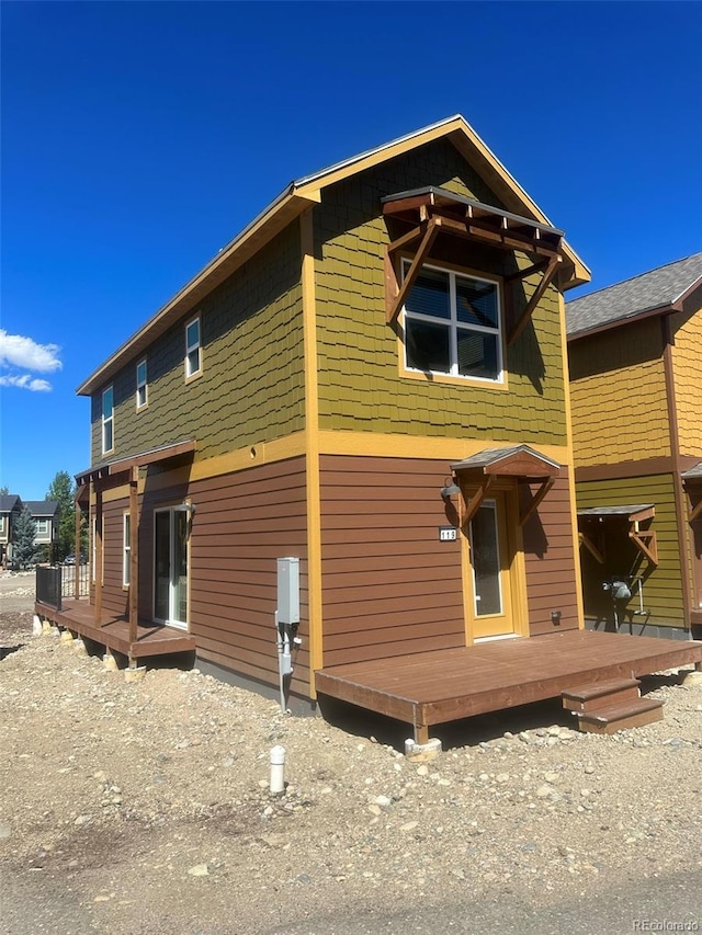 view of front of property featuring a wooden deck