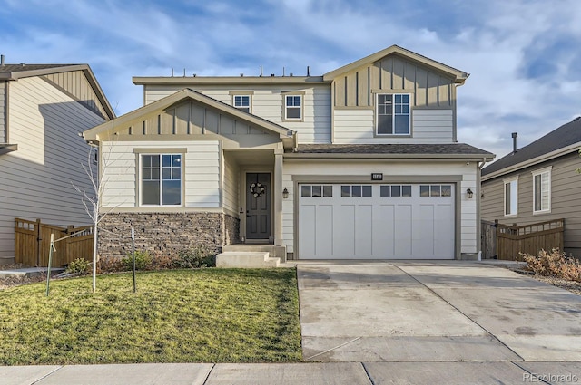 6645 Dry Fork Dr, Frederick, CO 80516 - view of front of house featuring board and batten siding, concrete driveway, an attached garage, and stone siding