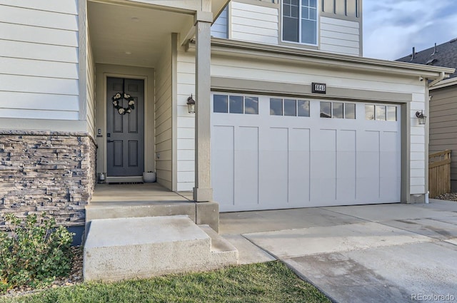 doorway to property featuring a garage