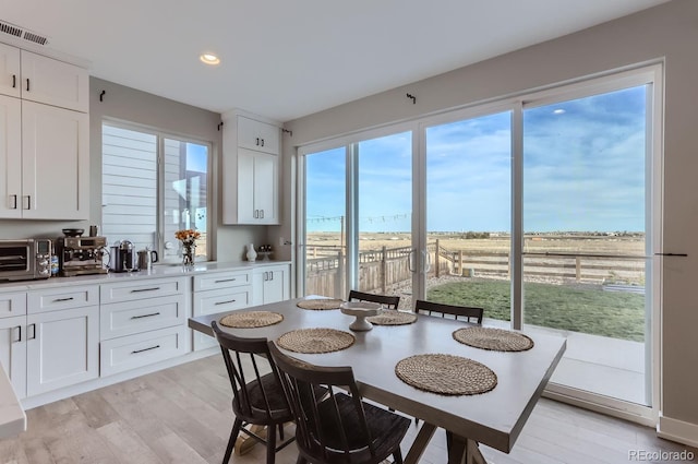 6645 Dry Fork Dr, Frederick, CO 80516 - dining area featuring light wood-style flooring and recessed lighting