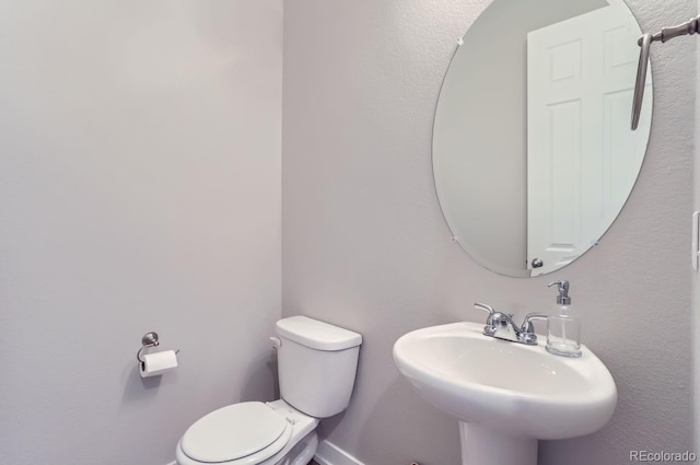 6645 Dry Fork Dr, Frederick, CO 80516 - bathroom with toilet, a sink, and baseboards