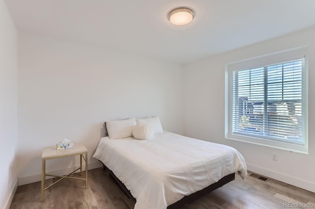 6645 Dry Fork Dr, Frederick, CO 80516 - bedroom featuring wood finished floors and baseboards