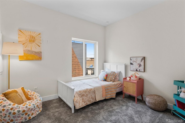 carpeted bedroom featuring baseboards