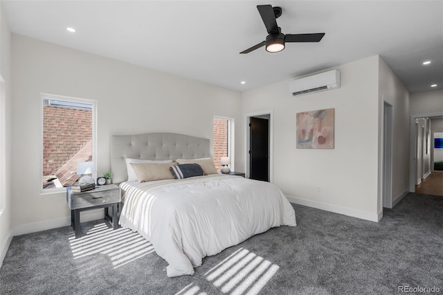 carpeted bedroom with a wall mounted AC, baseboards, recessed lighting, a ceiling fan, and multiple windows