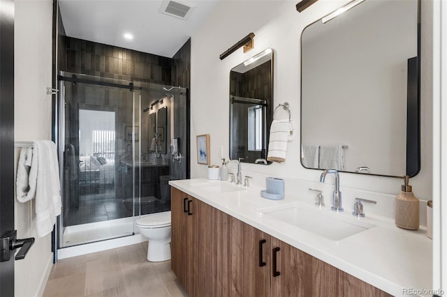 full bath featuring toilet, a stall shower, double vanity, tile patterned flooring, and recessed lighting