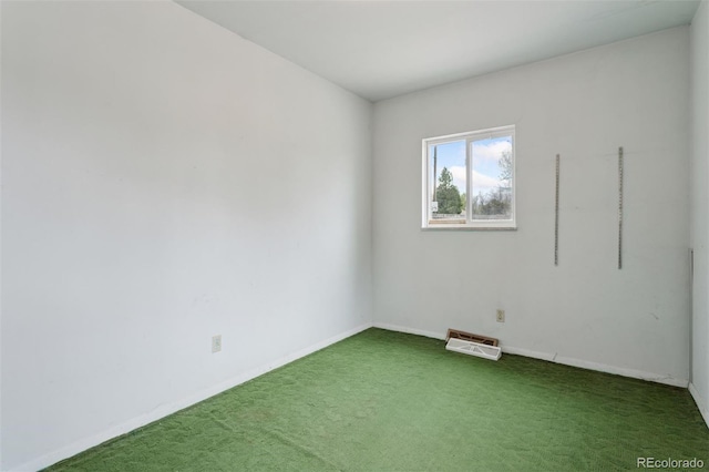 carpeted empty room with baseboards and visible vents