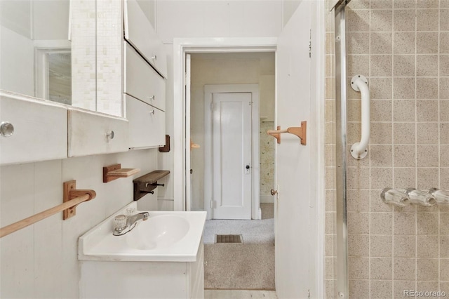 bathroom with visible vents and vanity