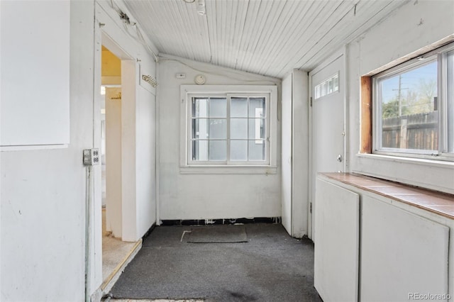 hallway featuring lofted ceiling