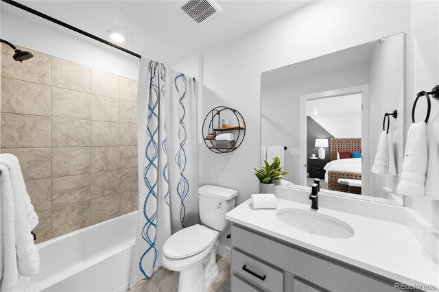 17137 W 91st Ln, Arvada, CO 80007 - ensuite bathroom with vanity, shower / bath combination with curtain, toilet, and tile patterned flooring