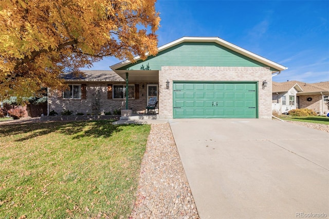 ranch-style home featuring a garage and a front lawn