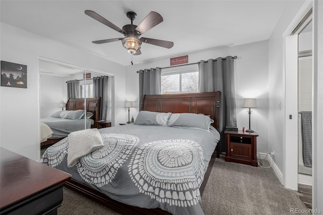 carpeted bedroom featuring ceiling fan, multiple windows, and a closet