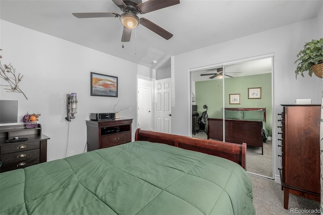 carpeted bedroom featuring ceiling fan and a closet