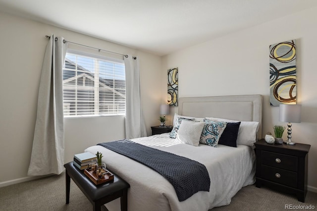 bedroom with carpet flooring and baseboards