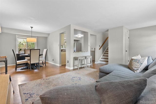 7306 S Dexter St, Centennial, CO 80122 - living room featuring wood finished floors and stairway