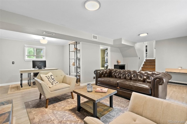 7306 S Dexter St, Centennial, CO 80122 - living area with wood finished floors, a desk, and stairway