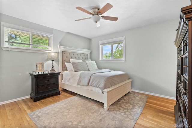 7306 S Dexter St, Centennial, CO 80122 - bedroom with multiple windows, light wood-type flooring, and a ceiling fan