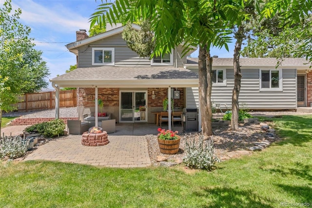 7306 S Dexter St, Centennial, CO 80122 - back of house with an outdoor fire pit, a patio area, a chimney, brick siding, and roof with shingles