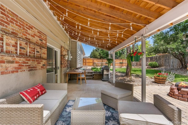 7306 S Dexter St, Centennial, CO 80122 - fenced backyard featuring an outdoor living space with a fire pit and a patio area