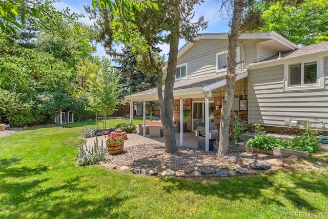 7306 S Dexter St, Centennial, CO 80122 - back of property with a patio, roof with shingles, and brick siding