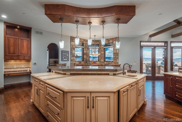 kitchen with light countertops and cream cabinetry