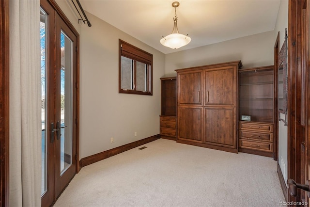 unfurnished bedroom with carpet floors, french doors, access to outside, and baseboards