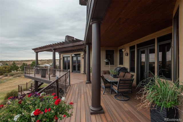 wooden terrace with french doors and a pergola