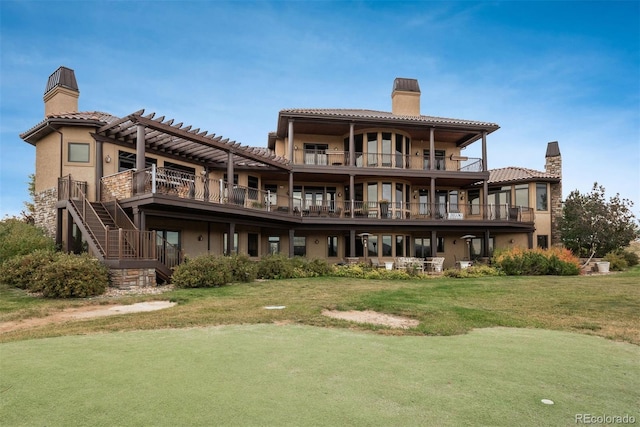 rear view of property with a pergola, stairway, a lawn, stucco siding, and a chimney