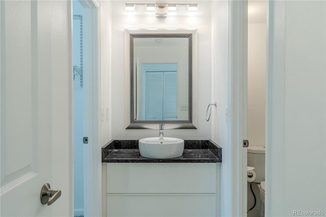 bathroom with vanity and toilet