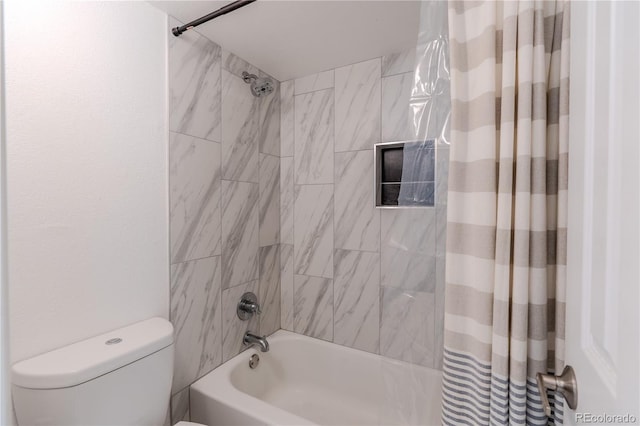 bathroom with shower / tub combo and toilet