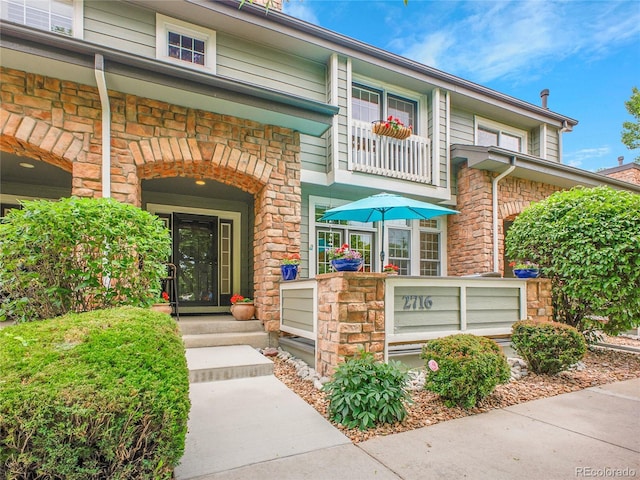 2716 W Greens Dr, Littleton, CO 80123 - property entrance featuring stone siding