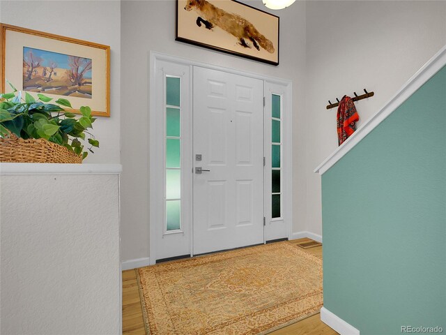 2716 W Greens Dr, Littleton, CO 80123 - foyer with wood finished floors and baseboards