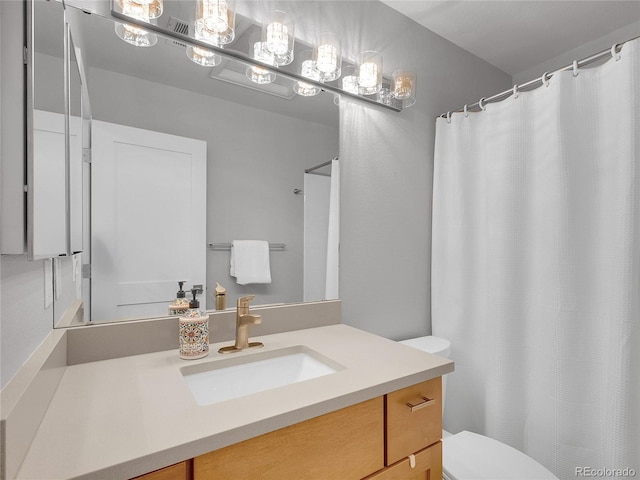 2716 W Greens Dr, Littleton, CO 80123 - full bath featuring toilet, vanity, and a shower with shower curtain