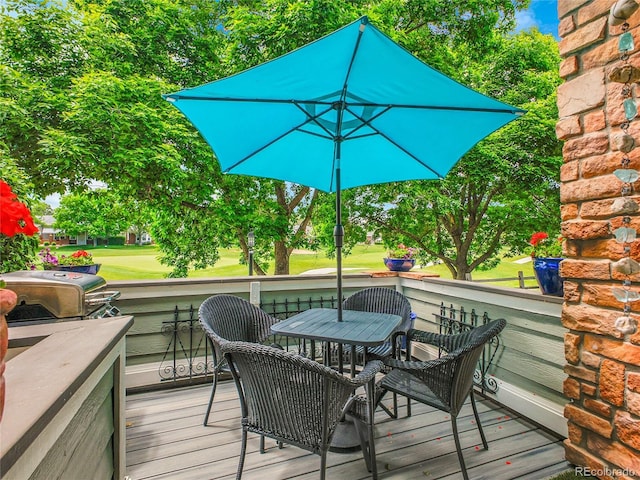 2716 W Greens Dr, Littleton, CO 80123 - deck with a grill and outdoor dining area
