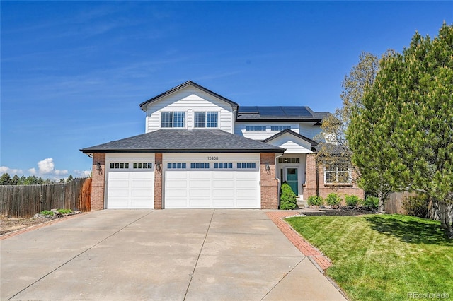 12408 W 83rd Ave, Arvada, CO 80005 - view of front of property featuring brick siding, driveway, and roof with shingles