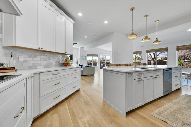 12408 W 83rd Ave, Arvada, CO 80005 - kitchen featuring a sink, dishwasher, healthy amount of natural light, tasteful backsplash, and recessed lighting